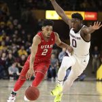 Utah guard Sedrick Barefield (2) drives as Arizona State's Luguentz Dort defends during the second half of an NCAA college basketball game Thursday, Jan. 3, 2019, in Tempe, Ariz. (AP Photo/Ralph Freso)