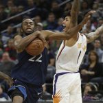 Minnesota Timberwolves' Andrew Wiggins drives the ball past Phoenix Suns' Devin Booker in the first half of an NBA basketball game Sunday, Jan. 20, 2019, in Minneapolis. (AP Photo/Stacy Bengs)