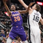 Phoenix Suns' Josh Jackson (20) shoots against San Antonio Spurs' Pau Gasol during the first half of an NBA basketball game, Tuesday, Jan. 29, 2019, in San Antonio. (AP Photo/Darren Abate)