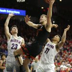 Oregon State forward Tres Tinkle (3) drives between Arizona guard Alex Barcello and Ira Lee (11) in the first half during an NCAA college basketball game, Saturday, Jan. 19, 2019, in Tucson, Ariz. (AP Photo/Rick Scuteri)