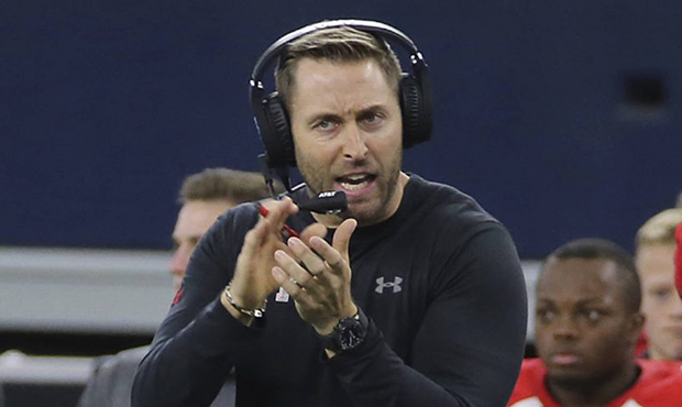 Texas Tech head coach Kliff Kingsbury encourages his players in the second half of an NCAA college ...