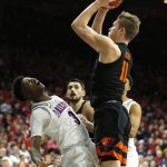 Arizona guard Dylan Smith (3) draws an offensive foul on Oregon State guard Zach Reichle in the first half during an NCAA college basketball game, Saturday, Jan. 19, 2019, in Tucson, Ariz. (AP Photo/Rick Scuteri)