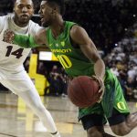 Oregon's Victor Bailey Jr. (10) drives around Arizona State's Kimani Lawrence (14) during the first half of an NCAA college basketball game Saturday, Jan. 19, 2019, in Tempe, Ariz. (AP Photo/Darryl Webb)