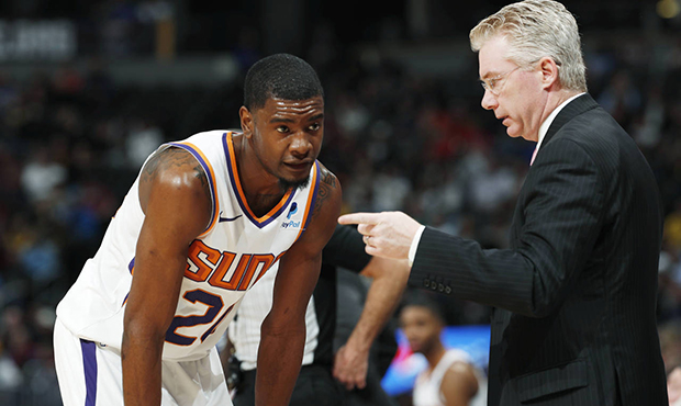 Phoenix Suns forward Josh Jackson, left, listens to assistant coach Joe Prunty during a timeout in ...