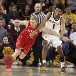 Utah guard Parker Van Dyke (5) and Arizona State guard Remy Martin (1) scramble to gain possession of a loose ball during the second half of an NCAA college basketball game Thursday, Jan. 3, 2019, in Tempe, Ariz. (AP Photo/Ralph Freso)