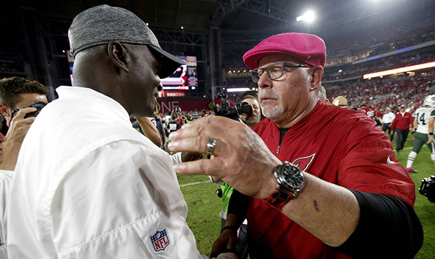Arizona Cardinals head coach Bruce Arians, right, greets New York Jets head coach Todd Bowles after...