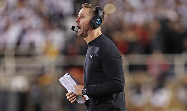 Texas Tech coach Kliff Kingsbury yells out to his team during a timeout in the second half of an NC...