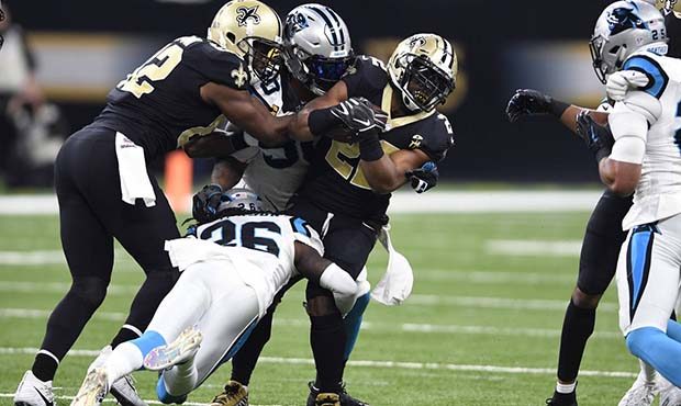 New Orleans Saints running back Mark Ingram (22) is tackled by Carolina Panthers cornerback Donte J...