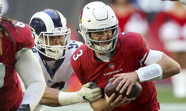 Arizona Cardinals quarterback Josh Rosen (3) is sacked by Los Angeles Rams defensive end Aaron Dona...