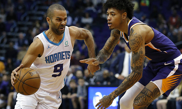 Charlotte Hornets guard Tony Parker (9) drives past Phoenix Suns forward Kelly Oubre Jr. in the fir...
