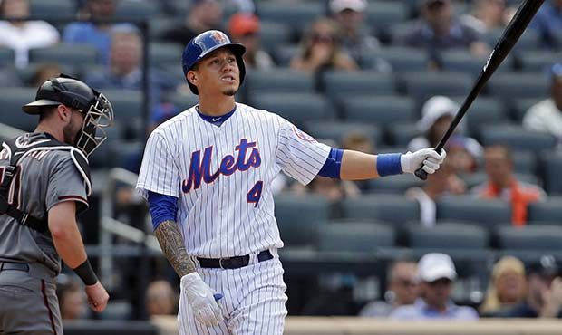 New York Mets Wilmer Flores (4) reacts after striking out in front of Arizona Diamondbacks catcher ...