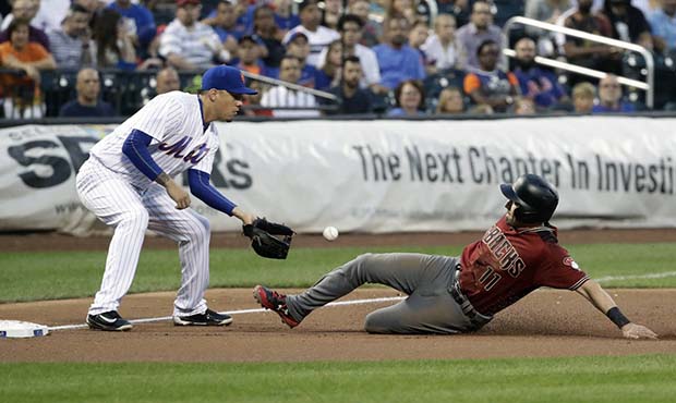 Arizona Diamondbacks' A.J. Pollock (11) slides past New York Mets Wilmer Flores to third base on a ...
