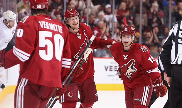 Ray Whitney #13 of the Phoenix Coyotes celebrates with Shane Doan #19 after assisting on a second p...