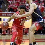 Utah guard Sedrick Barefield, left, attempts to drive past Arizona forward Ryan Luther during the second half of an NCAA college basketball game Thursday, Feb. 14, 2019, in Salt Lake City. (AP Photo/Alex Goodlett)