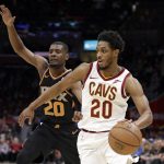 Cleveland Cavaliers' Brandon Knight, right, drives past Phoenix Suns' Josh Jackson in the first half of an NBA basketball game, Thursday, Feb. 21, 2019, in Cleveland. (AP Photo/Tony Dejak)