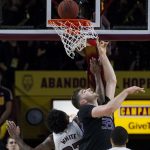Washington's Sam Timmins (33) watches a shot by Arizona State's Romello White (23) fall during the first half of an NCAA college basketball game Saturday, Feb. 9, 2019, in Tempe, Ariz. (AP Photo/Darryl Webb)