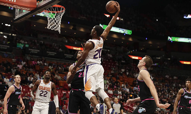 Phoenix Suns forward Josh Jackson (20) shoots against Miami Heat center Hassan Whiteside (21) durin...