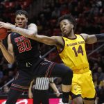 Utah's Timmy Allen (20) competes with Arizona State's Kimani Lawrence (14) for a rebound during the second half of an NCAA college basketball game Saturday, Feb. 16, 2019, in Salt Lake City. Arizona State won 98-87. (AP Photo/Kim Raff)
