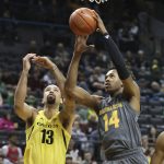 Arizona State's Kimani Lawrence, right, pulls down a rebound next to Oregon's Paul White during the first half of an NCAA college basketball game Thursday, Feb. 28, 2019, in Eugene, Ore. (AP Photo/Chris Pietsch)