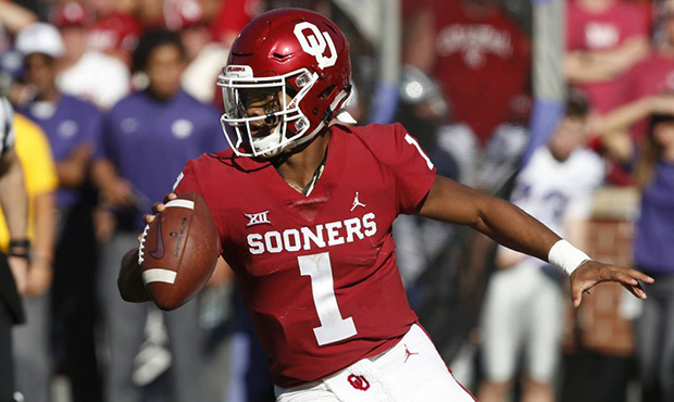 File - In this Oct. 27, 2018, file photo, Oklahoma quarterback Kyler Murray maneuvers during the te...