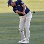 Matt Kuchar hits onto the 18th green during the second round of the Phoenix Open PGA golf tournament, Friday, Feb. 1, 2019, in Scottsdale, Ariz. (AP Photo/Matt York)