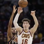 Cleveland Cavaliers' Cedi Osman (16), from Turkey, passes against Phoenix Suns' Mikal Bridges (25) in the second half of an NBA basketball game, Thursday, Feb. 21, 2019, in Cleveland. (AP Photo/Tony Dejak)