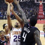 Phoenix Suns forward Mikal Bridges shoots as Los Angeles Clippers forward JaMychal Green defends during the first half of an NBA basketball game Wednesday, Feb. 13, 2019, in Los Angeles. (AP Photo/Mark J. Terrill)