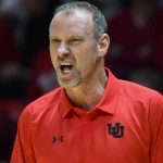 Utah coach Larry Krystkowiak yells to players during the first half of the team's NCAA college basketball game against Arizona on Thursday, Feb. 14, 2019, in Salt Lake City. (AP Photo/Alex Goodlett)