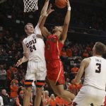 Oregon State's Kylor Kelley (24) blocks a shot by Arizona's Chase Jeter (4) during the second half of an NCAA college basketball game in Corvallis, Ore., Thursday, Feb. 28, 2019. Arizona won 74-72. (AP Photo/Amanda Loman)