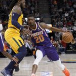 Phoenix Suns' Josh Jackson (20) attempts to dribble past Utah Jazz's Jae Crowder during the first half of an NBA basketball game Wednesday, Feb. 6, 2019, in Salt Lake City. (AP Photo/Kim Raff)