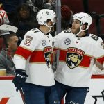 Florida Panthers left wing Mike Hoffman (68) celebrates his goal against the Arizona Coyotes with Jonathan Huberdeau (11) during the second period of an NHL hockey game Tuesday, Feb. 26, 2019, in Glendale, Ariz. (AP Photo/Ross D. Franklin)