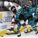 Arizona Coyotes defenseman Kevin Connauton (44) battles for the puck against San Jose Sharks right wing Joonas Donskoi (27) during the first period of an NHL hockey game in San Jose, Calif., Saturday, Feb. 2, 2019. (AP Photo/Tony Avelar)