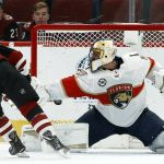 Arizona Coyotes center Nick Cousins, left, scores a goal against Florida Panthers goaltender Roberto Luongo during the shootout in an NHL hockey game Tuesday, Feb. 26, 2019, in Glendale, Ariz. The Coyotes won 4-3. (AP Photo/Ross D. Franklin)