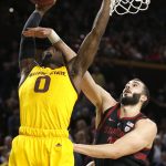 Arizona State guard Luguentz Dort (0) is fouled by Stanford forward Trevor Stanback during the second half of an NCAA college basketball game Wednesday, Feb. 20, 2019, in Tempe, Ariz. Arizona State won 80-62. (AP Photo/Rick Scuteri)