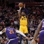 Utah Jazz's Donovan Mitchell (45) shoots over Phoenix Suns' Richaun Holmes (21) during the second half of an NBA basketball game Wednesday, Feb. 6, 2019, in Salt Lake City. The Jazz won the game 116-88. (AP Photo/Kim Raff)