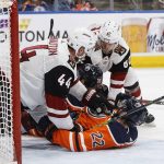 Arizona Coyotes' Kevin Connauton (44) and Jordan Oesterle (82) protect the net from Edmonton Oilers' Tobias Rieder (22) during the second period of an NHL hockey game Tuesday, Feb. 19, 2019, in Edmonton, Alberta. (Jason Franson/The Canadian Press via AP)