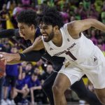 Arizona State's Remy Martin, right, reaches the ball with Washington's Matisse Thybulle during the second half of an NCAA college basketball game Saturday, Feb. 9, 2019, in Tempe, Ariz. Arizona State won 75-63. (AP Photo/Darryl Webb)