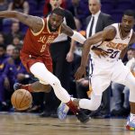 Houston Rockets forward James Ennis III (8) steals the ball away from Phoenix Suns forward Josh Jackson (20) during the first half of an NBA basketball game,, Monday, Feb. 4, 2019, in Phoenix. (AP Photo/Matt York)