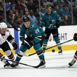 San Jose Sharks right wing Timo Meier (28) moves the puck between Arizona Coyotes center Nick Cousins (25) and Alex Galchenyuk (17) during the first period of an NHL hockey game in San Jose, Calif., Saturday, Feb. 2, 2019. (AP Photo/Tony Avelar)