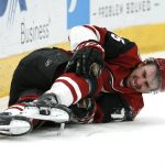 Arizona Coyotes defenseman Kyle Capobianco reacts after getting checked during the third period of the team's NHL hockey game against the Columbus Blue Jackets, Thursday, Feb. 7, 2019, in Glendale, Ariz. Capobianco left the game.Columbus won 4-2. (AP Photo/Rick Scuteri)