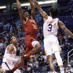 Houston Rockets forward Kenneth Faried (35) shoots over Phoenix Suns forward Kelly Oubre Jr. (3) during the first half of an NBA basketball game, Monday, Feb. 4, 2019, in Phoenix. (AP Photo/Matt York)