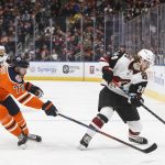 Arizona Coyotes' Mario Kempe (29) is chased by Edmonton Oilers' Oscar Klefbom (77) during the first period of an NHL hockey game Tuesday, Feb. 19, 2019, in Edmonton, Alberta. (Jason Franson/The Canadian Press via AP)