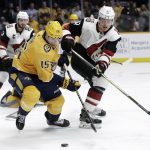 Nashville Predators right wing Craig Smith (15) chases the puck with Arizona Coyotes left wing Lawson Crouse (67) during the second period of an NHL hockey game Tuesday, Feb. 5, 2019, in Nashville, Tenn. (AP Photo/Mark Humphrey)