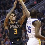 Phoenix Suns forward Kelly Oubre Jr. (3) shoots over Golden State Warriors forward Kevin Durant during the second half of an NBA basketball game Friday, Feb. 8, 2019, in Phoenix. The Warriors won 117-107. (AP Photo/Ross D. Franklin)