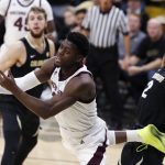 Arizona State guard Luguentz Dort, center, is fouled as he drives to the rim for a basket as Colorado forward Lucas Siewert, left, and guard Daylen Kountz, right, defend in the first half of an NCAA college basketball game Wednesday, Feb. 13, 2019, in Boulder, Colo. (AP Photo/David Zalubowski)