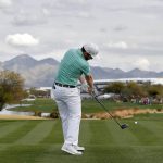 Branden Grace hits from the 15th tee during the third round of the Phoenix Open PGA golf tournament, Saturday, Feb. 2, 2019, in Scottsdale, Ariz. (AP Photo/Matt York)