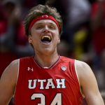 Utah center Jayce Johnson (34) celebrates a play during the second half of an NCAA college basketball game against Arizona, Thursday, Feb. 14, 2019, in Salt Lake City. (AP Photo/Alex Goodlett)