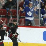 Arizona Coyotes center Alex Galchenyuk (17) celebrates his goal with Coyotes center Nick Cousins (25) as Toronto Maple Leafs fans react to the celebration during the second period of an NHL hockey game Saturday, Feb. 16, 2019, in Glendale, Ariz. (AP Photo/Ross D. Franklin)