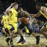 Oregon's Payton Pritchard, left, and Francis Okoro pressure Arizona State's Rob Edwards during the first half of an NCAA college basketball game Thursday, Feb. 28, 2019, in Eugene, Ore. (AP Photo/Chris Pietsch)