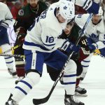 Toronto Maple Leafs right wing Mitchell Marner (16) passes the puck between his legs against the Arizona Coyotes during the first period of an NHL hockey game Saturday, Feb. 16, 2019, in Glendale, Ariz. (AP Photo/Ross D. Franklin)